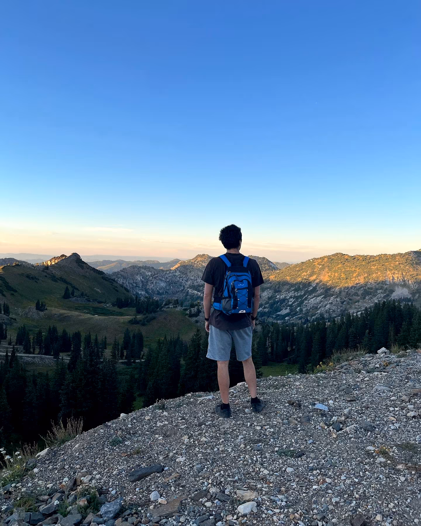 Jess LeFevre, CHPC standing on a mountain peak in Alta, Utah
